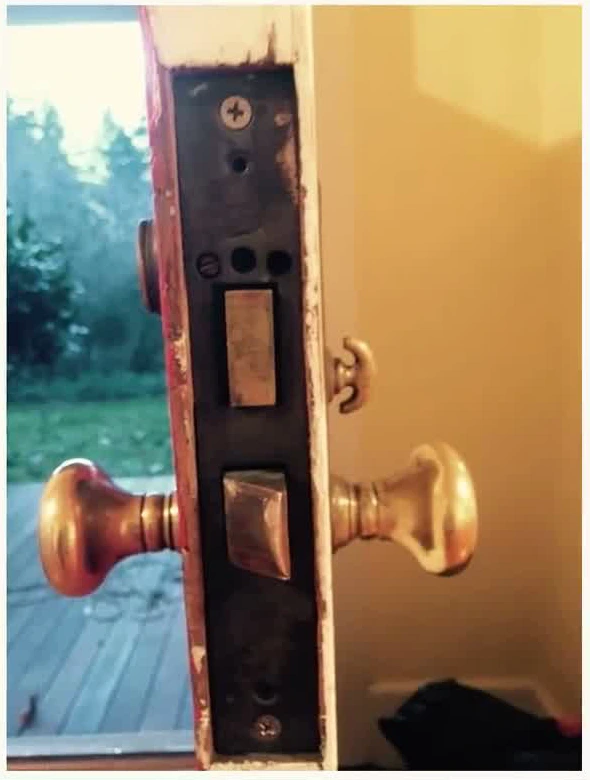 Mortise lock body pulled from a door edge during a commercial lock job