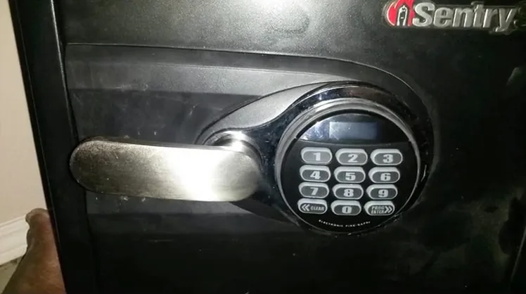 Keypad and lever handle on a SentrySafe fire safe after a lockout call